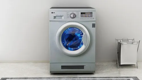 Technician repairing washing machine